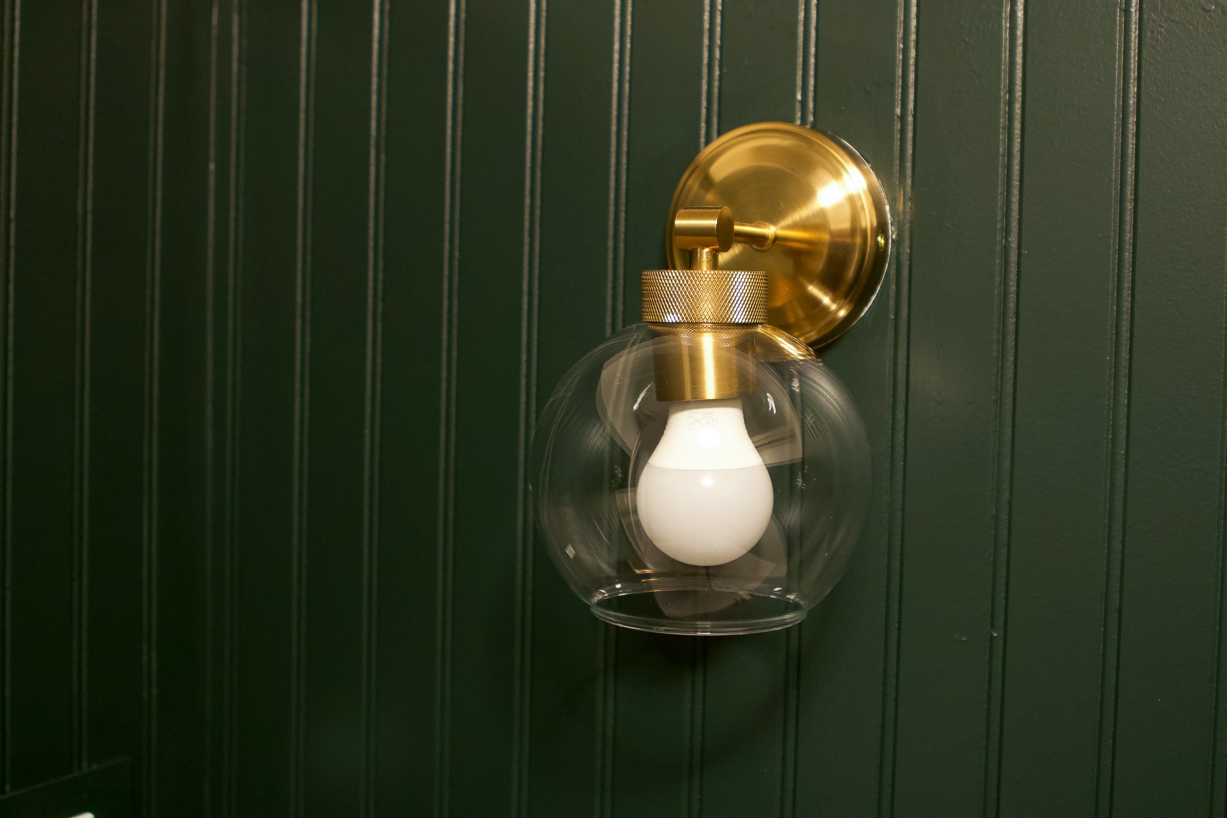 Gold sconces in the bathroom