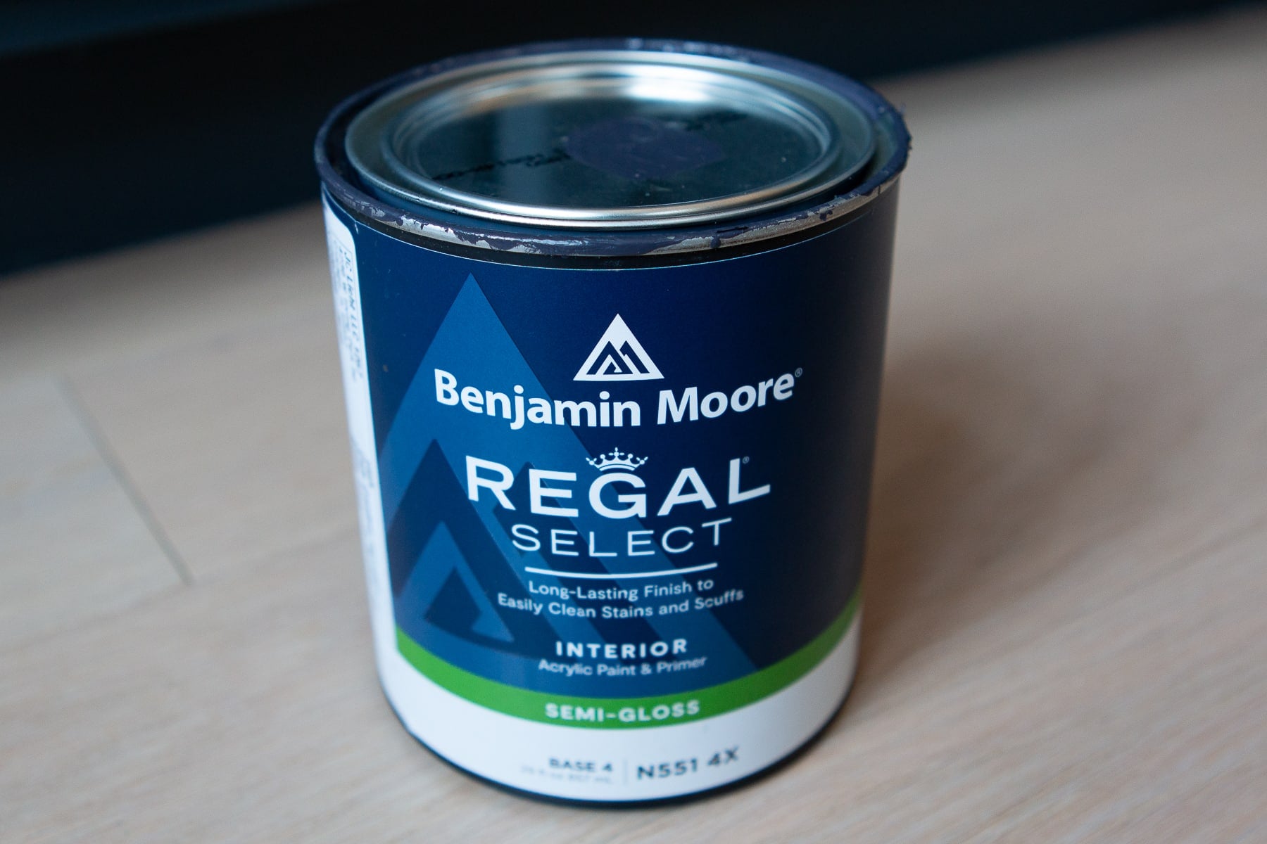A can of Benjamin Moore regal paint in a semi-gloss sheen