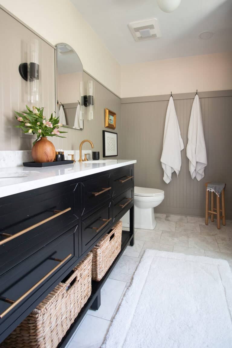 Bathroom with black double sink vanity.
