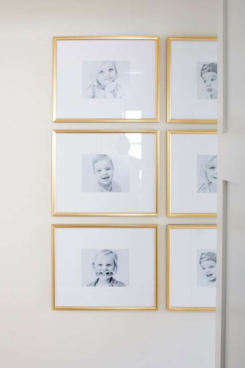 Adding a gold symmetrical gallery wall to the hallway