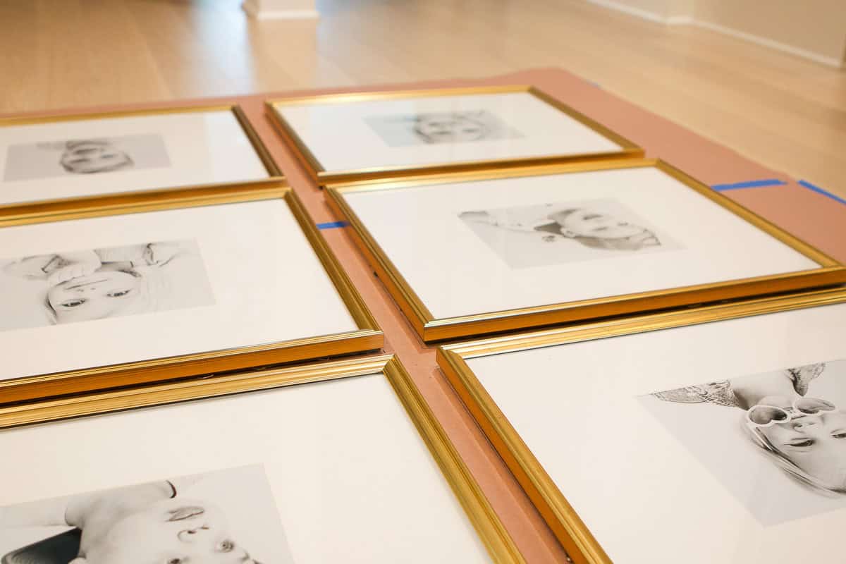 Gold frames with black and white photos in them