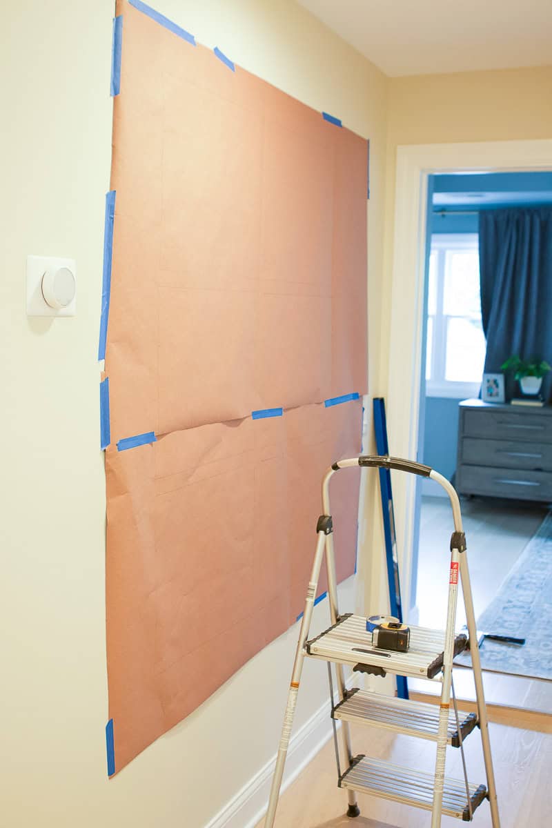 Tape your rosin paper on the wall and level it before hanging your gallery wall