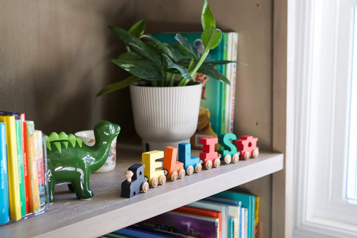 Adding decor to a little boy's bookshelves
