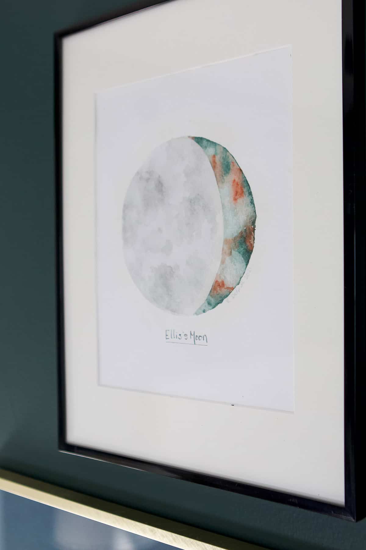 Ellis' moon hanging over the dresser
