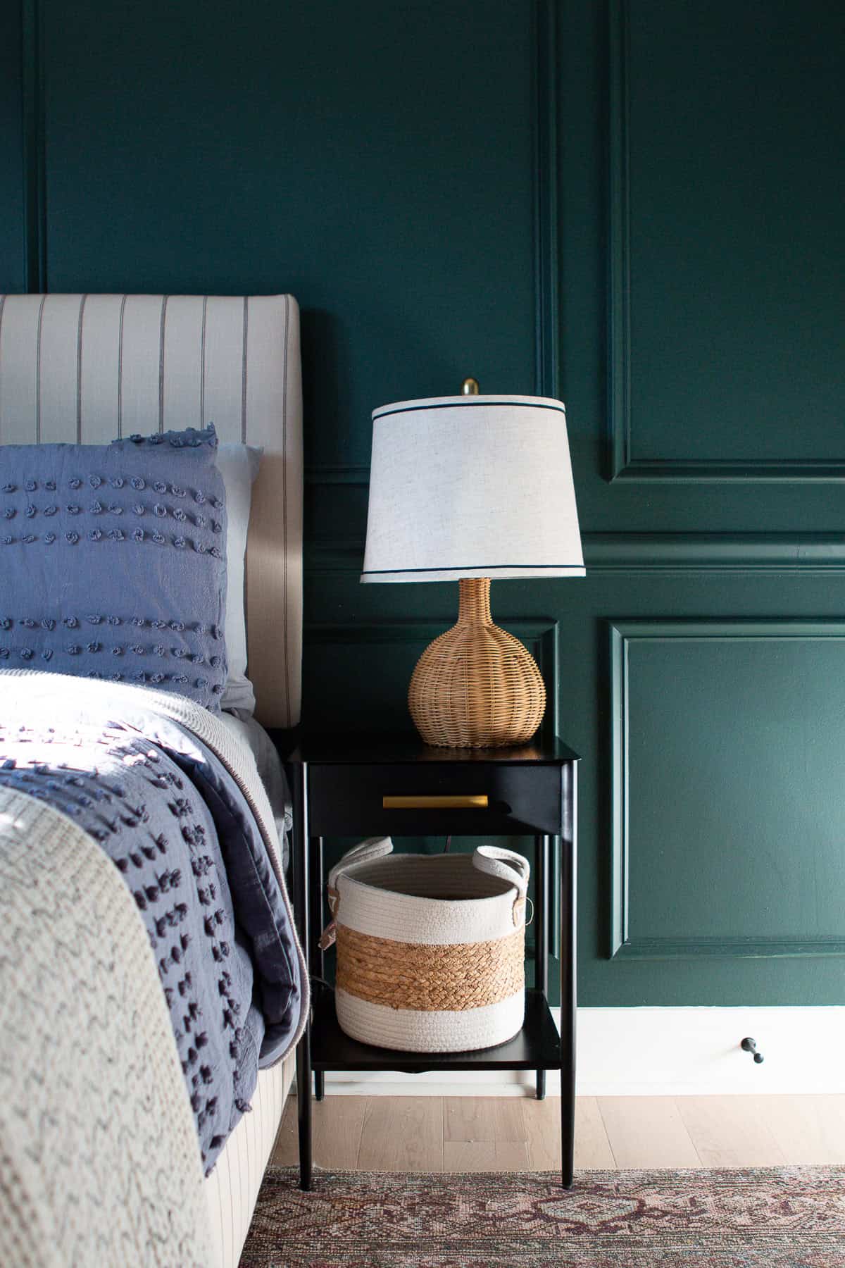 Black nightstand with rattan lamp