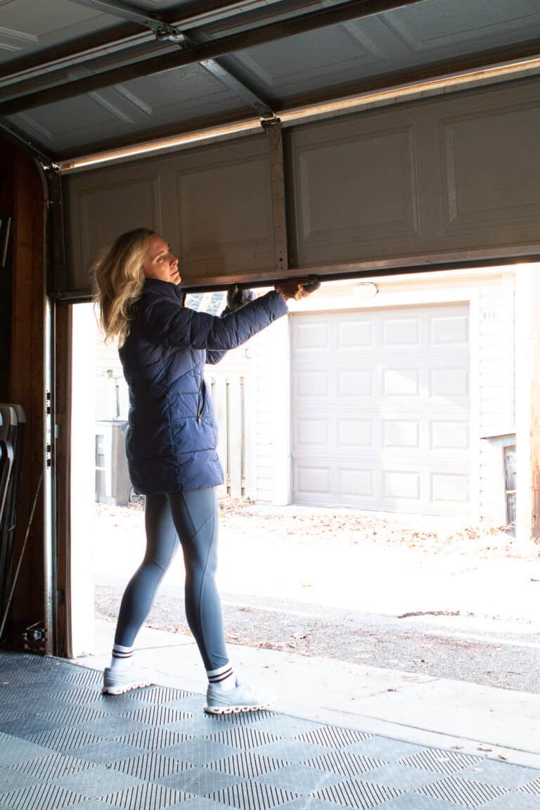 Pull the new weatherstripping through the channel on the bottom of the garage door