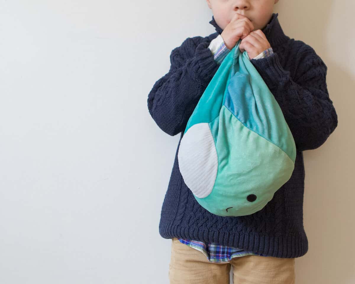 ellis with his stuffed dinosaur lovey