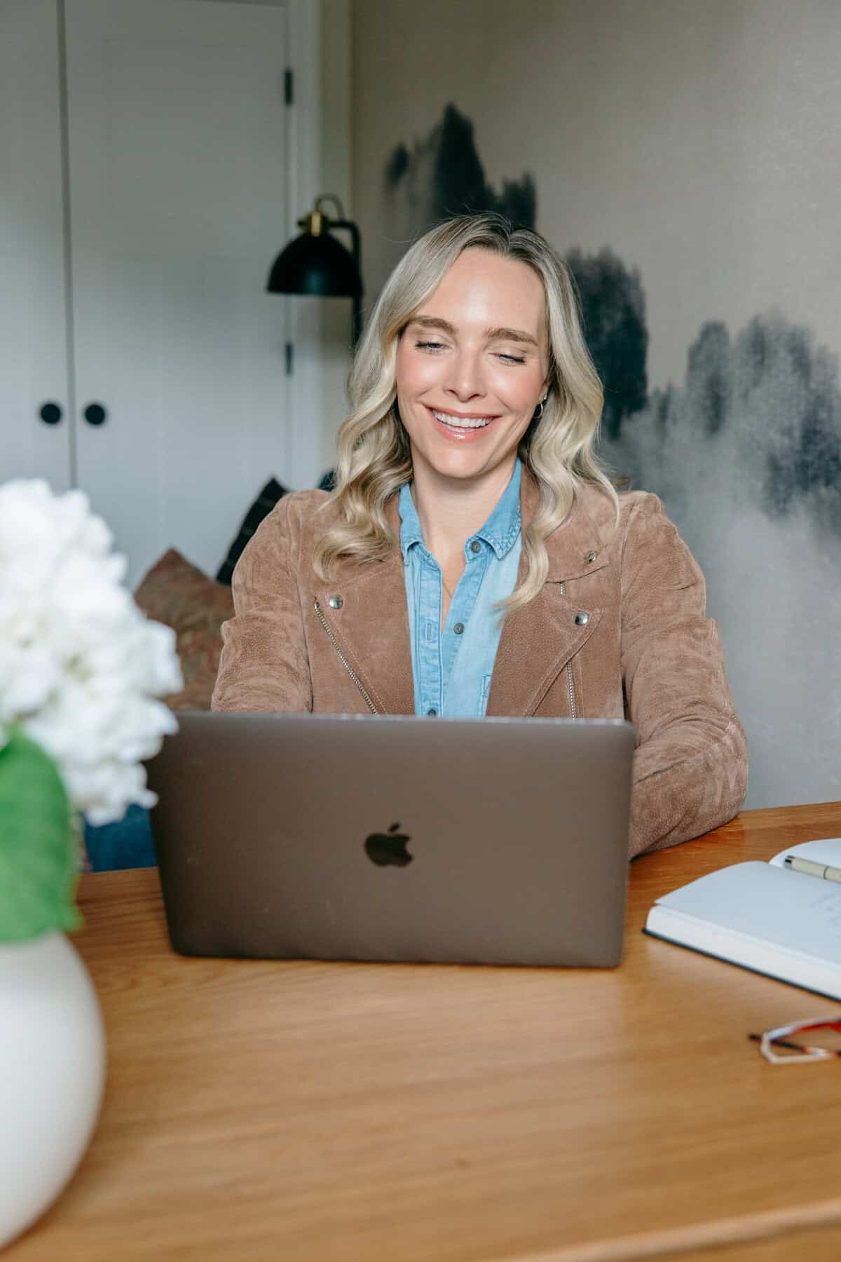 a woman on her laptop in a home office